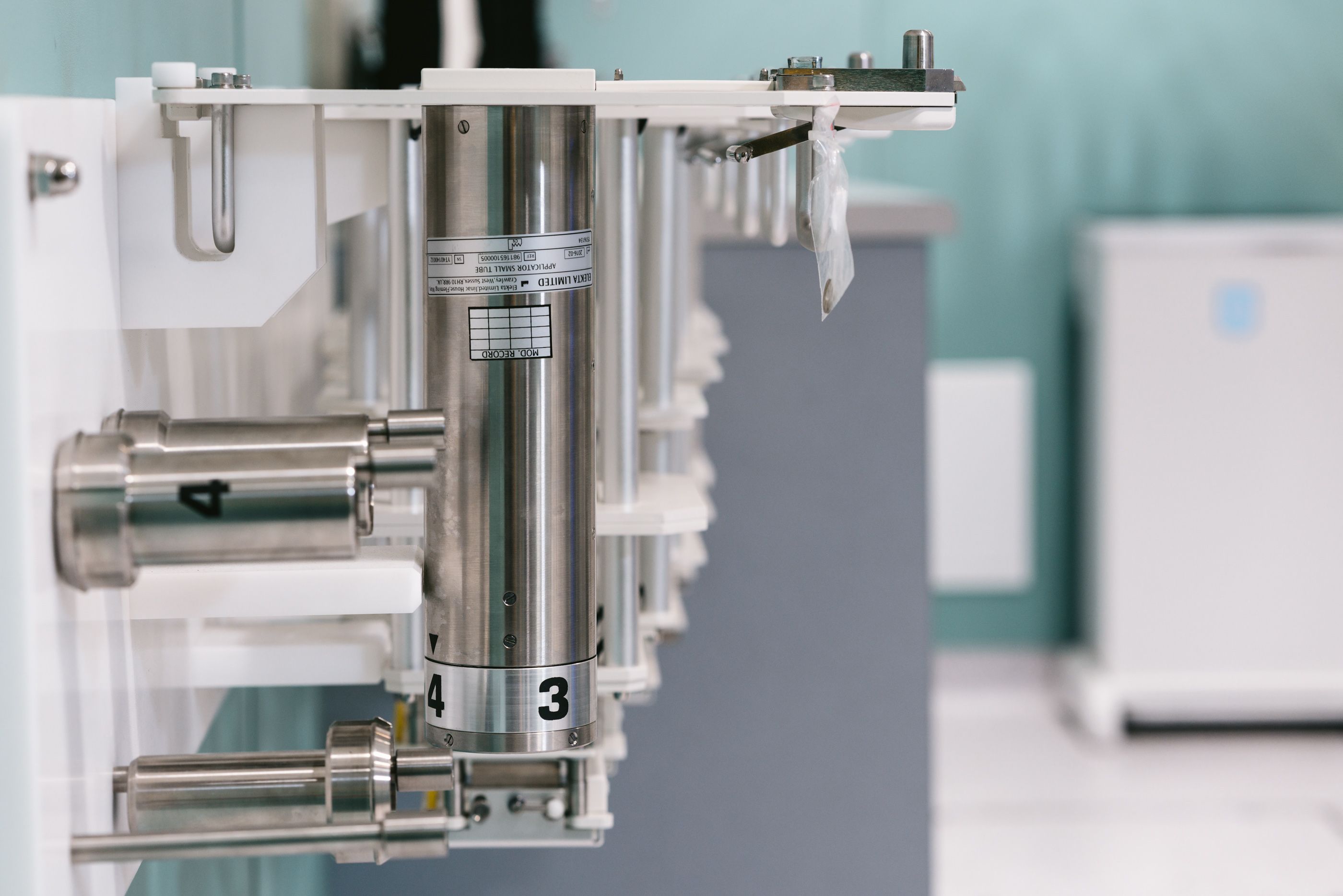 Illustrative stock photograph: clean stainless steel precision machinery